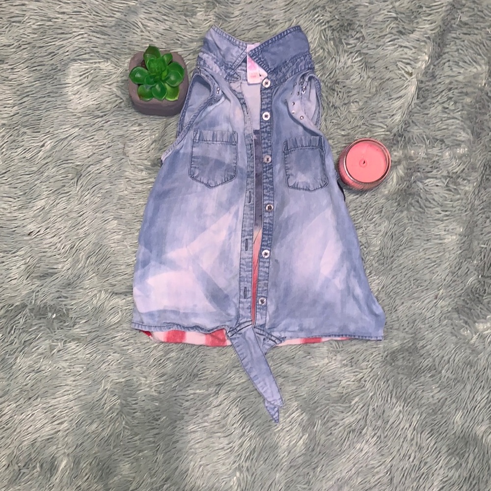 blue jean jacket, with american flag and dimonds on back.